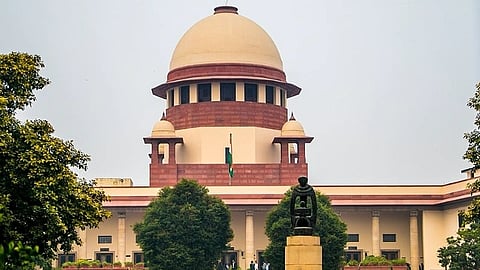 Supreme court of India building and flag in front.