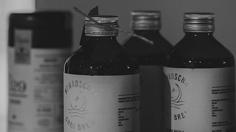 Stock of codeine-based cough syrup bottles.