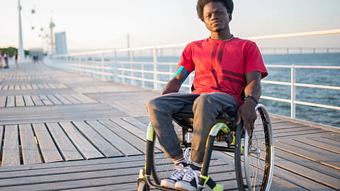 DMD patient sitting on a wheelchair