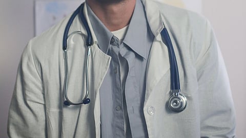 A doctor with stethoscope around neck.