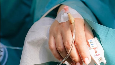 A patient with IV on hand.