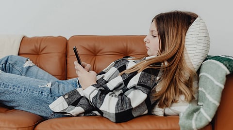 Girls using a mobile phone