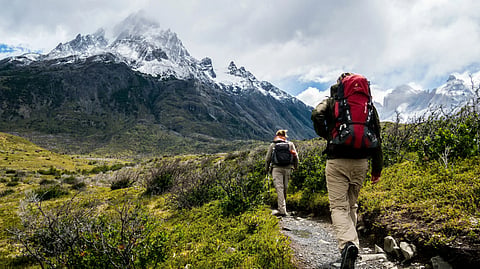 two people walking in the Himalayas