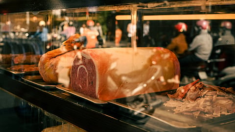 street view of deli window with meat display