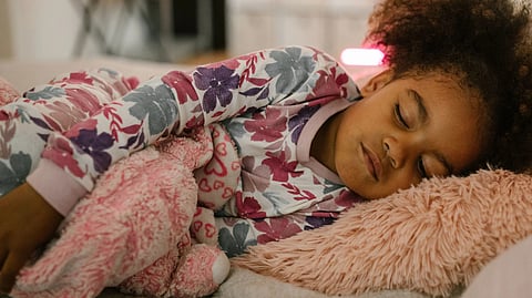 child sleeping with a toy