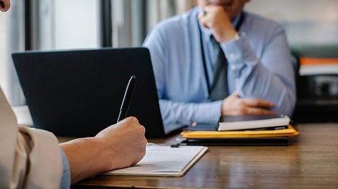 person filling application form 