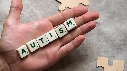 Autism written with letter boxes and kept on hand.