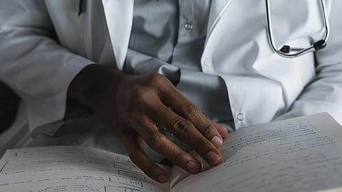 close up shot of a physician reading their notes