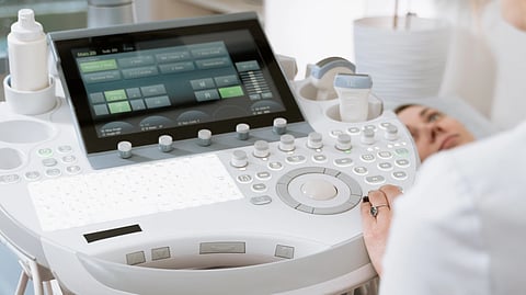 Close-up of a professional conducting an ultrasound examination in a modern medical clinic