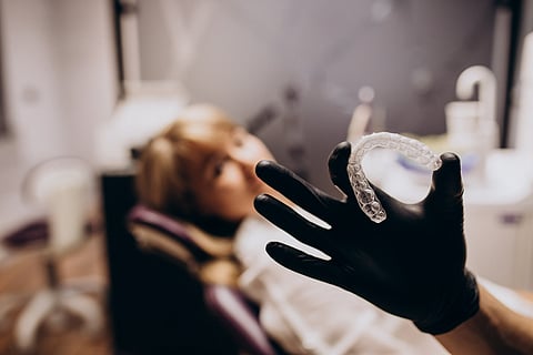 Woman patient getting invisalign
