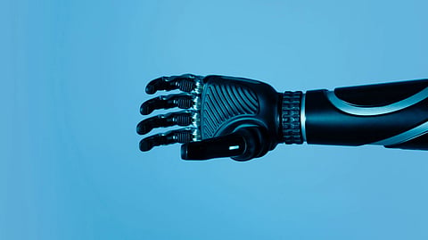 A high-tech robotic prosthetic arm reaching upwards on a blue background, symbolizing innovation in biotechnology