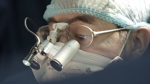 Doctor wearing magnifying lens used in surgeries