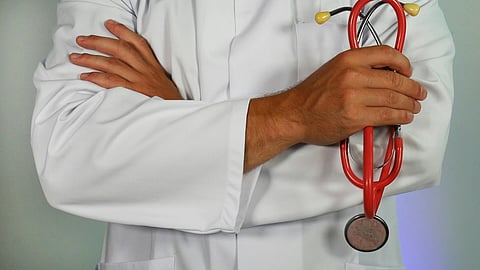 A doctor holding stethoscope
