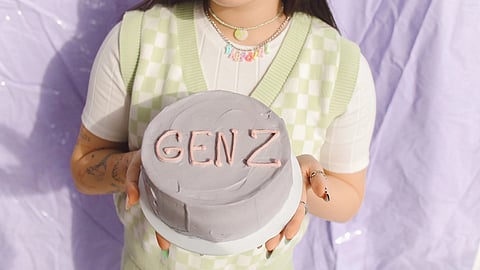 GenZ holding a cake