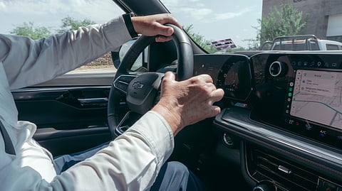 driver steering modern vehicle with gps navigation 