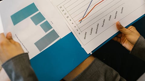 person holding white printer paper