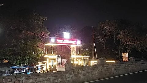 The building of AMC college at night.