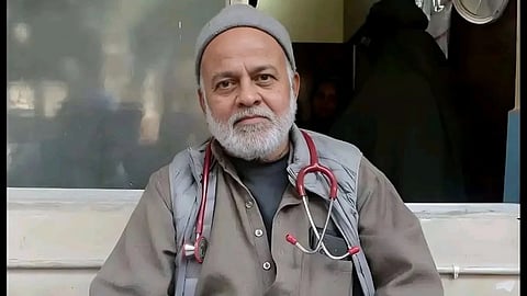 Dr. Ejaz Ali sitting in his clinic