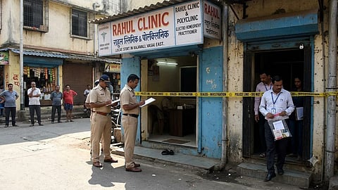 Police investigating a seized clinic
