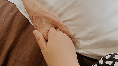 two people holding each others hands