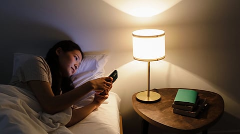 Woman staying up late at night