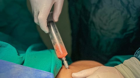 person applying syringe on someone's skin