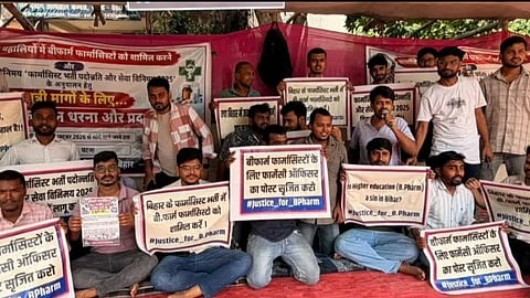B.Pharm students on hunger strike and protest with banners.
