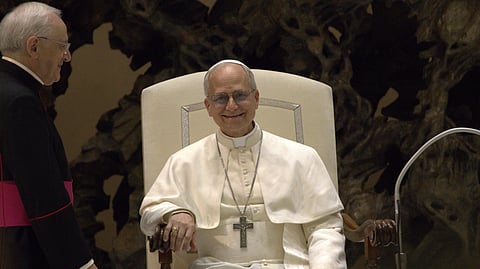 Pope Leo sitting on his chair