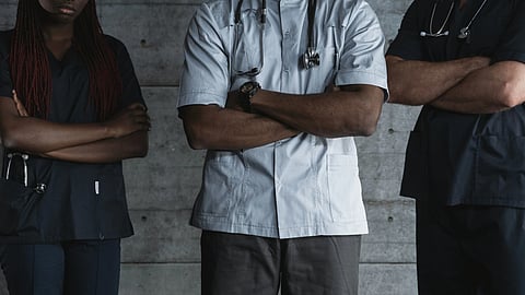 Doctors standing with folded arms