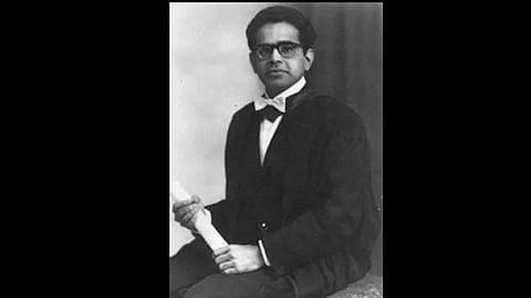 Portrait of Dr. Sudhansu with degree rolled in hand.