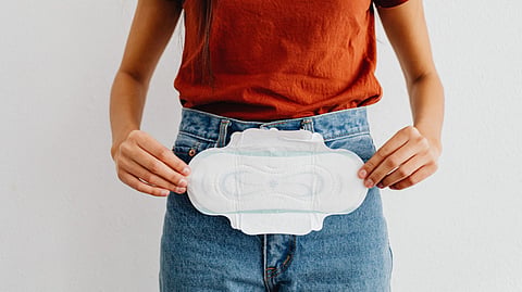 Woman holding a sanitary pad