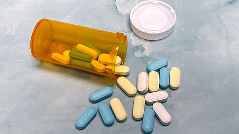 Pills spilling out of container