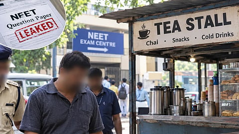 A tea stall owner with a blurred face is escorted by officials near a NEET exam centre amid an investigation into the alleged NEET paper leak