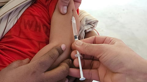 arm of a kid getting injected