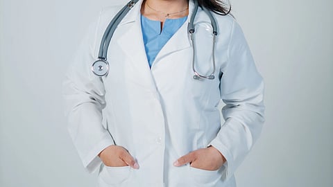 A woman doctor with stethoscope around neck.