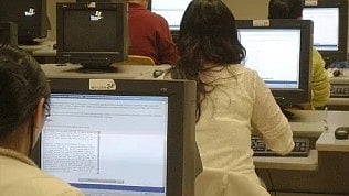 Neet candidates using computer to give test.