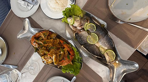 seafood feast with grilled fish and side dishes