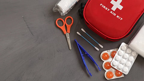 first aid kit on gray background