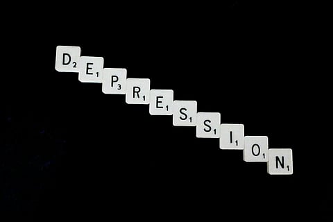 Depression, spelled out in white scrabble tiles.
