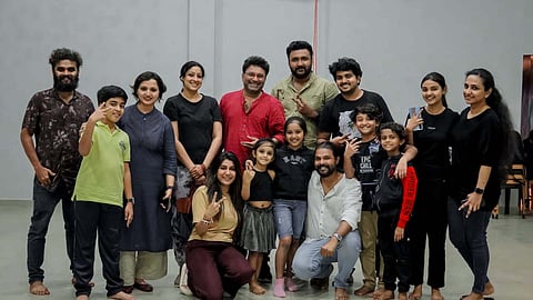 Child artist Devananda with film 'Gu' team. 