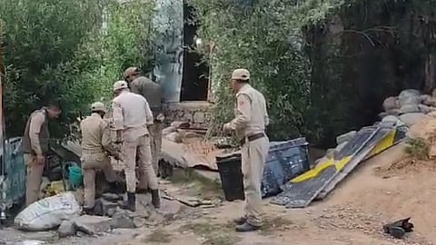 Police investigate the blast spot