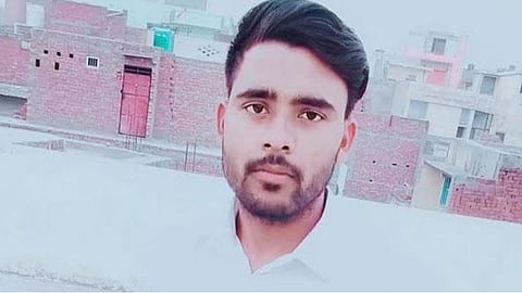 A young man who attempted suicide in front of the Parliament building has died.