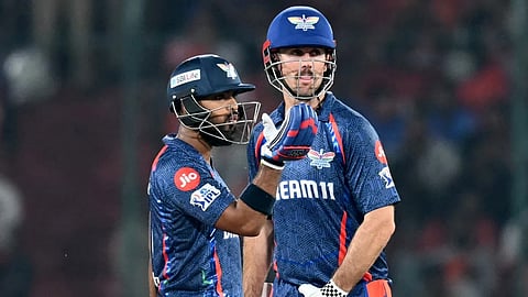 Nicholas Pooran and Mitchell Marsh during the match