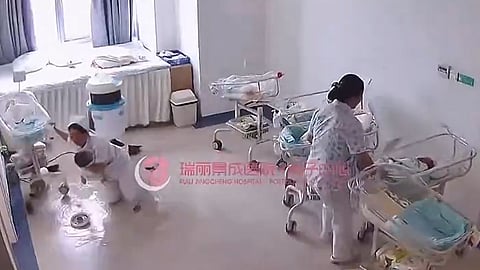nurses shields new born babies during earthquake
