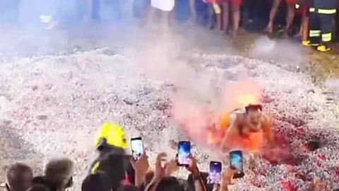 A 56-year-old man died tragically after falling into burning embers during a temple festival