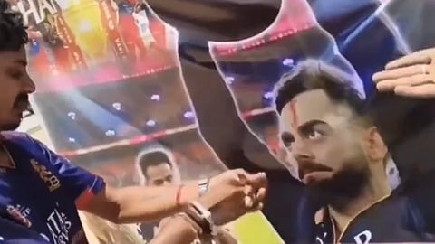 Blood tilak on Kohli's poster, viral video