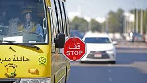 Abu Dhabi Police instructions about Do not overtake school buses with stop signs