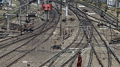 car falls on railway tracks 