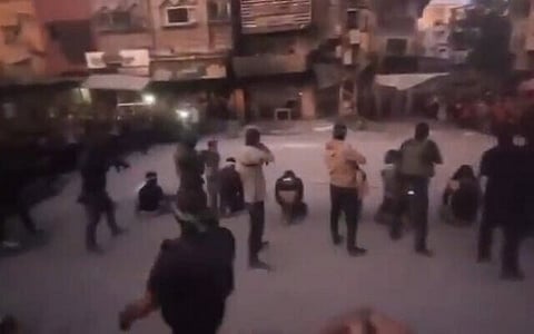 Palestinians accused of collaborating with Israel are seen blindfolded moments before being executed by Hamas gunmen on a Gaza street, October 13, 2025