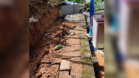 A well and a wall collapsed due to heavy rain